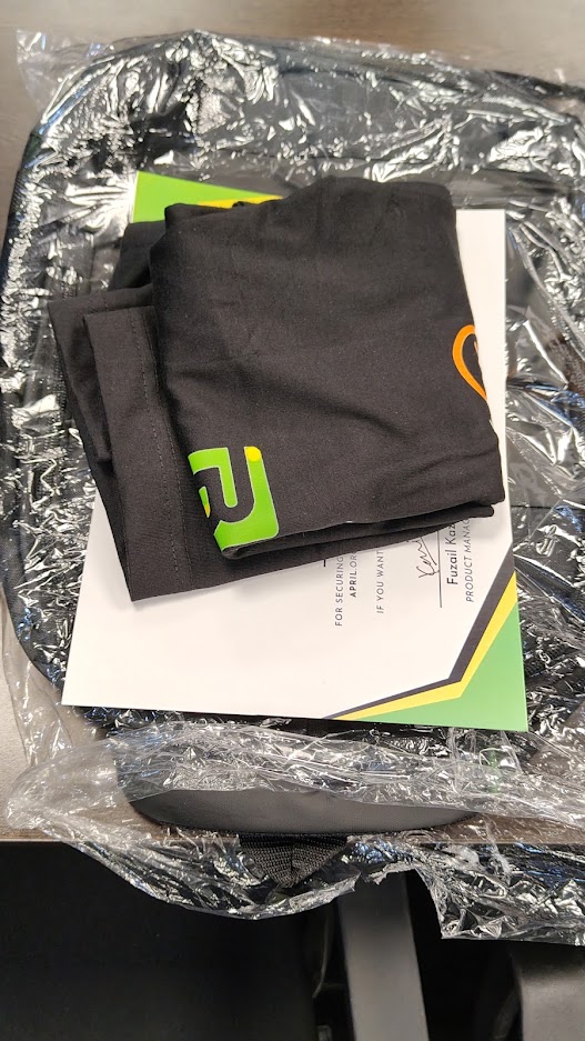 Team receiving awards and merchandise at GfG HQ